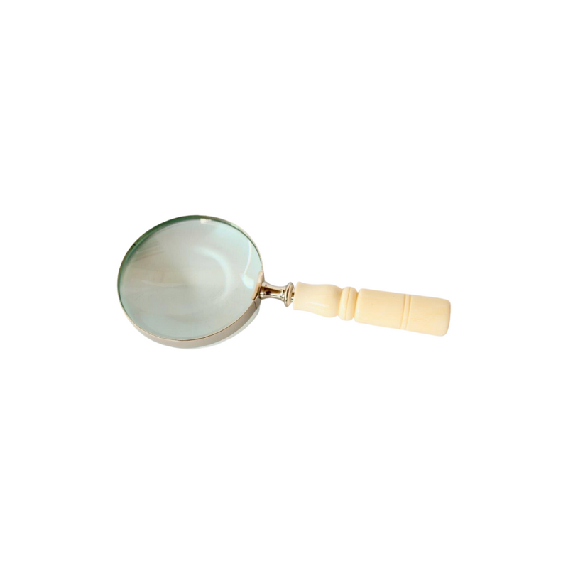 This silver magnifying glass with its brass detailing will be sure to add a touch of sophistication to any home. Crafted with precision, it measures 23 x 10cm and is sure to make all the small details shine. Perfect for anyone looking for luxurious home accessories. Delivery   7 - 10 working days