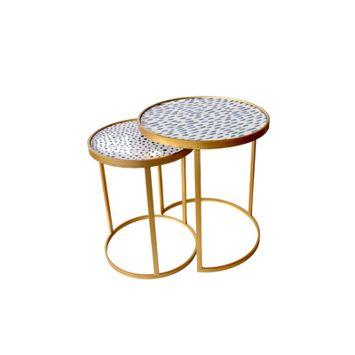 This set of two nesting tables measure 56x50 centimetres and feature a stunning combination of blue and gold hues, making them perfect for any living room or interior setting. An essential home decor item, these tables offer unique interior styling solutions. Delivery 5 - 7 working days