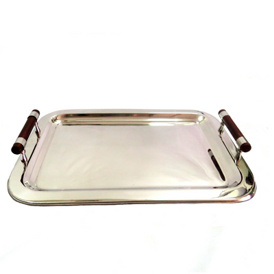 Expertly crafted with mirror polished, stainless steel, the Trade Off Tray measures 56cm in length and 40cm in width. Its wooden handles exude elegance and functionality, making it the perfect tray for any occasion. Elevate your serving game with this sleek and stylish Trade Off Tray-unique interiors