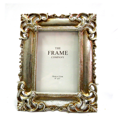 Display your cherished memories in style with our St Silver Frame. The stunning antique silver design features intricate corner detailing and can hold a 4″ X 6″ or 10CM X 15CM photo. Elevate your home decor with this elegant and unique frame-unique interiors