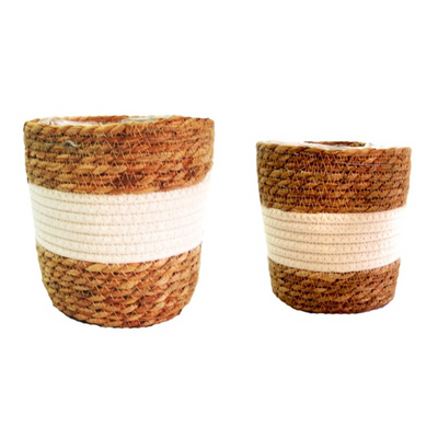 This set of 2 plastic lined baskets features a thick central border of white cotton, creating a fresh and stunning planter set. Each basket is expertly woven in natural materials, with the bigger basket measuring 22.5cm in diameter and 19cm in height, while the smaller one measures 19cm in diameter and 16cm in height. Perfect for holding plants or organizing your home-unique interiors