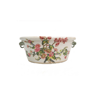 The Countess Camelia Footbath is an exquisite piece of porcelain, hand painted with vibrant floral designs. Its intricate detailing is sure to add an alluring charm to any space. This luxurious piece is perfect for relaxing feet after a long day. UNIQUE INTERIORS