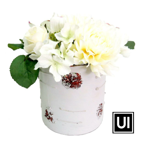 White flower arrangement  18cmH x 18cmD  Mixed white flowers in white pot with red detail great decor for great value  Unique Interiors