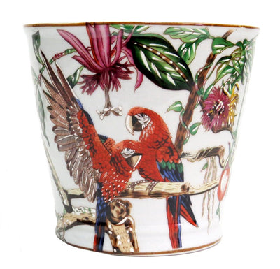This parrot planter adds a beautiful, tropical touch to any interior. Its hand-painted design features parrots, flowers and leaves for a unique aesthetic. The planter measures 15.5cmH X 17cmH, perfect for adding a touch of exotic flair to any room.