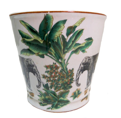 This Origins pot is perfect for adding a touch of tropical decor to your home. Crafted from porcelain, it features a stunning pattern of elephants and palm trees. With a size of 15.5cmD x 17cmH, this pot is the perfect addition to your tabletop or shelf.