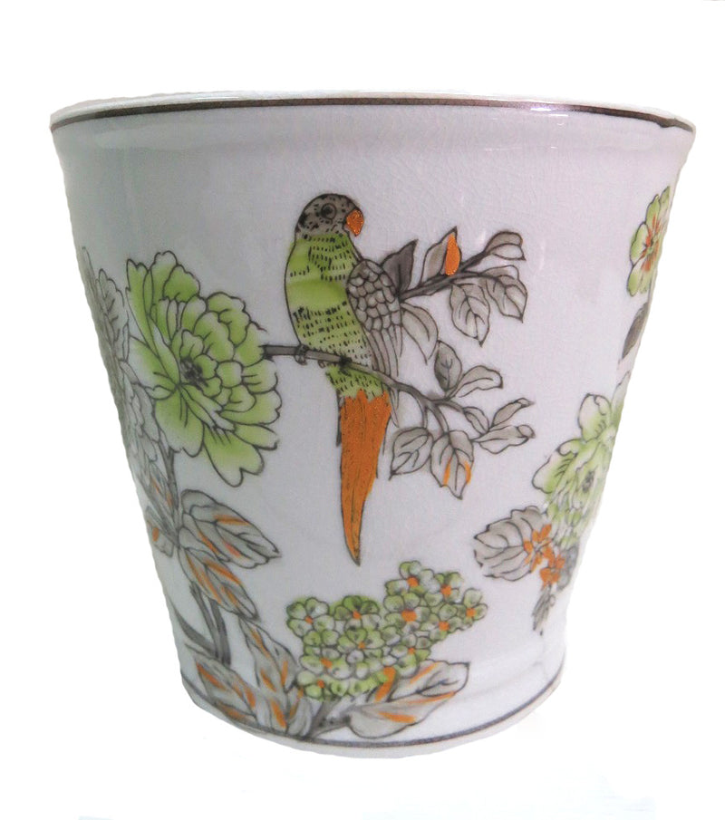 This Tahiti pot is crafted using high-quality porcelain and is handpainted with beautiful green leaves on a white background for a simple yet stunning design. Perfect for adding a touch of style to any home.