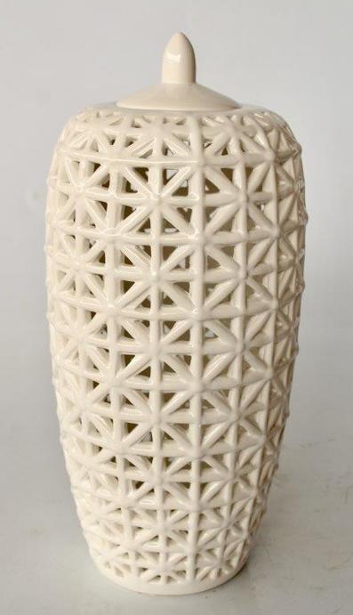 Tall white criss cross cut-out jar with lid