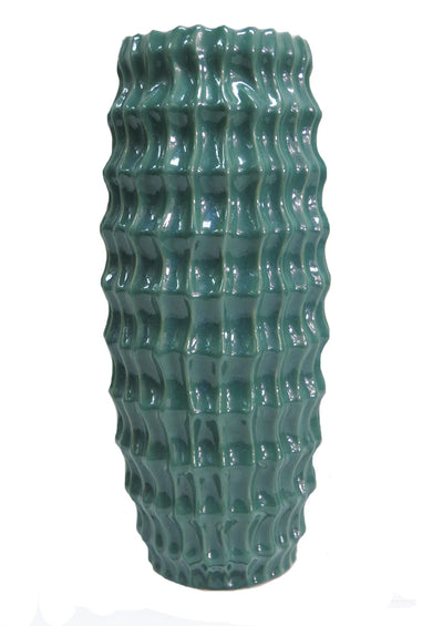 Create a beautiful vignette with the Diaspora vase. Crafted from high-quality ceramic to ensure long-lasting beauty, this elegant and eye-catching vase is expertly glazed with a teal intense colour for a stunning melted glass look. It's the perfect size to show off long-stemmed greenery and can easily become the centerpiece of any room.