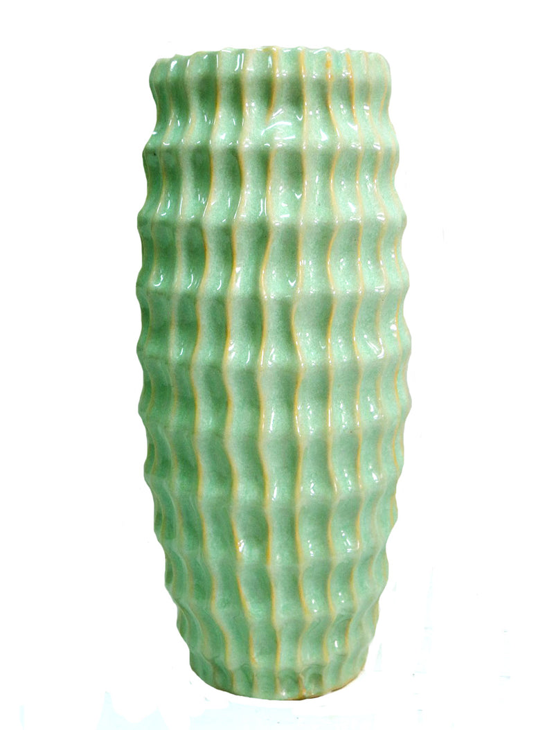Our Atlantis vase is a stunning piece of home decor, crafted with a beautiful lime green glaze to bring an eye-catching look wherever it is placed. This ceramic vase features an elegant shape that lends itself to both decorative and functional use.  Ideal for long stemmed greenery.