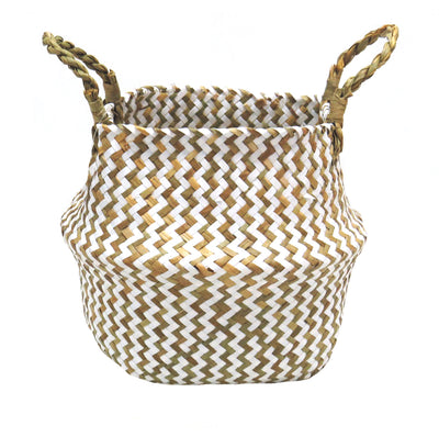This Persell basket features chevron weaving in white and natural colors, resulting in a unique and beautifully finished basket. The basket's natural twisted handles ensure a secure and sturdy grip while making it an attractive addition to any outdoor space- UNIQUE INTERIORS