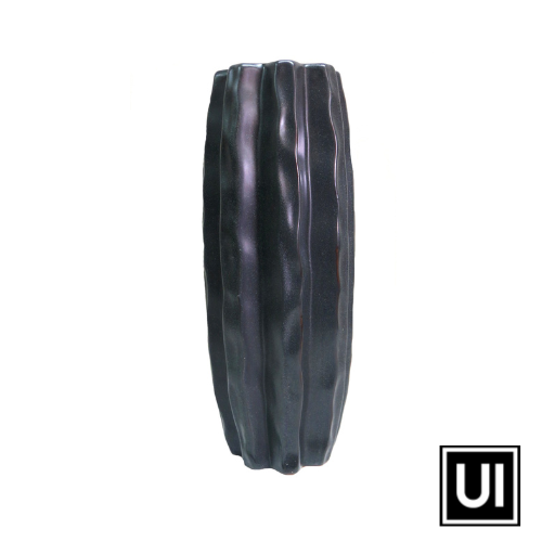 The Forum Vase is a stunning and versatile piece, handcrafted from dark stone ceramic with a speckle finish. Standing at 14.5cm in diameter and 37cm in height, it is the perfect size for displaying long-stemmed greenery, bringing nature indoors with style.  Unique Interiors
