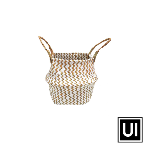 This Piccolo basket is made from chevron weave in stunning white and natural colors. Its exquisite twist handle makes it the perfect container for everyday items such as croissants, rolls and eggs. With its long-lasting quality and stylish finish, this basket will serve any purpose you require.   Unique Interiors.