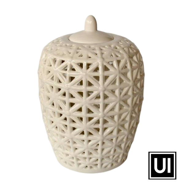 White fat criss-cross cut-out jar with lid 32x21cm  Introducing our White Fat Criss Cross Cut-Out Jar with Lid from Unique Interiors, a stunning piece that will add a touch of elegance and sophistication to any space in your home. This jar is expertly handcrafted to perfection, ensuring the highest quality of craftsmanship.