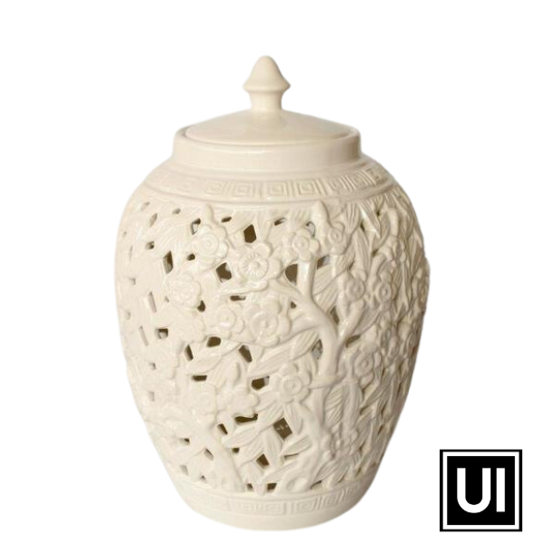White flower & leaf cut-out design barrel shade jar with lid 40x27cm  Introducing our White Flower & Leaf Cut-Out Design Barrel Shade Jar with Lid from Unique Interiors, a stunning piece that will add a touch of elegance and sophistication to any space in your home. This jar is expertly handcrafted to perfection, ensuring the highest quality of craftsmanship.